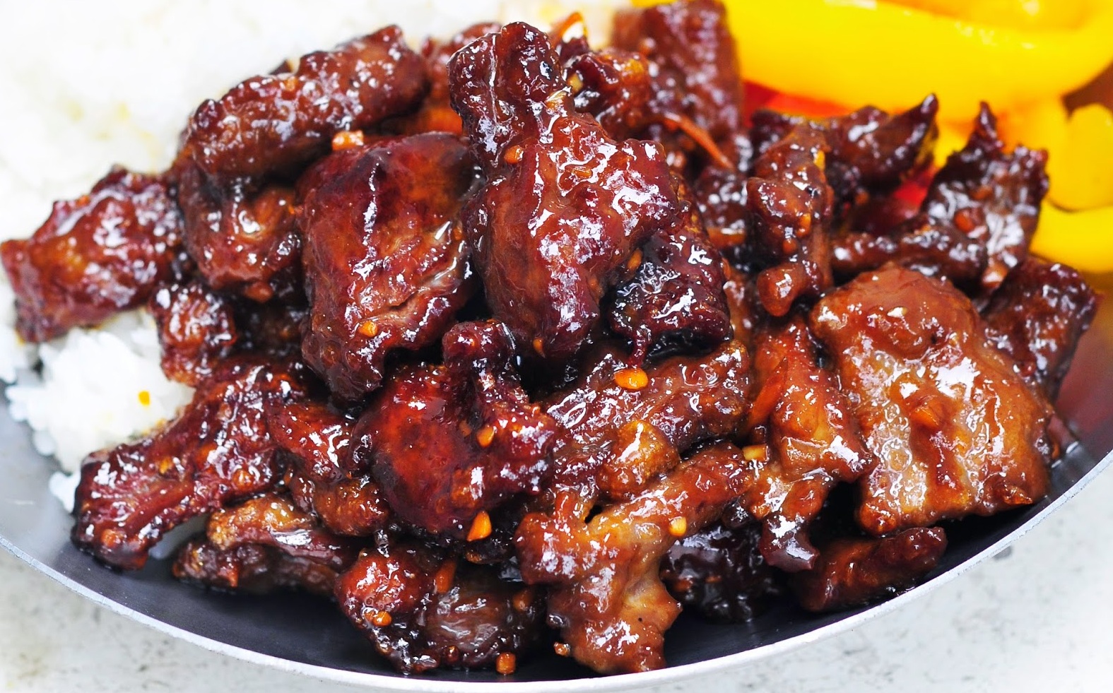 Crispy Orange beef is very tasty. We suggest long grain rice, veg and bamboo shoots as a side.