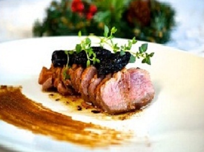 Luxurious duck breast topped with juicy prunes and sprigs of thyme